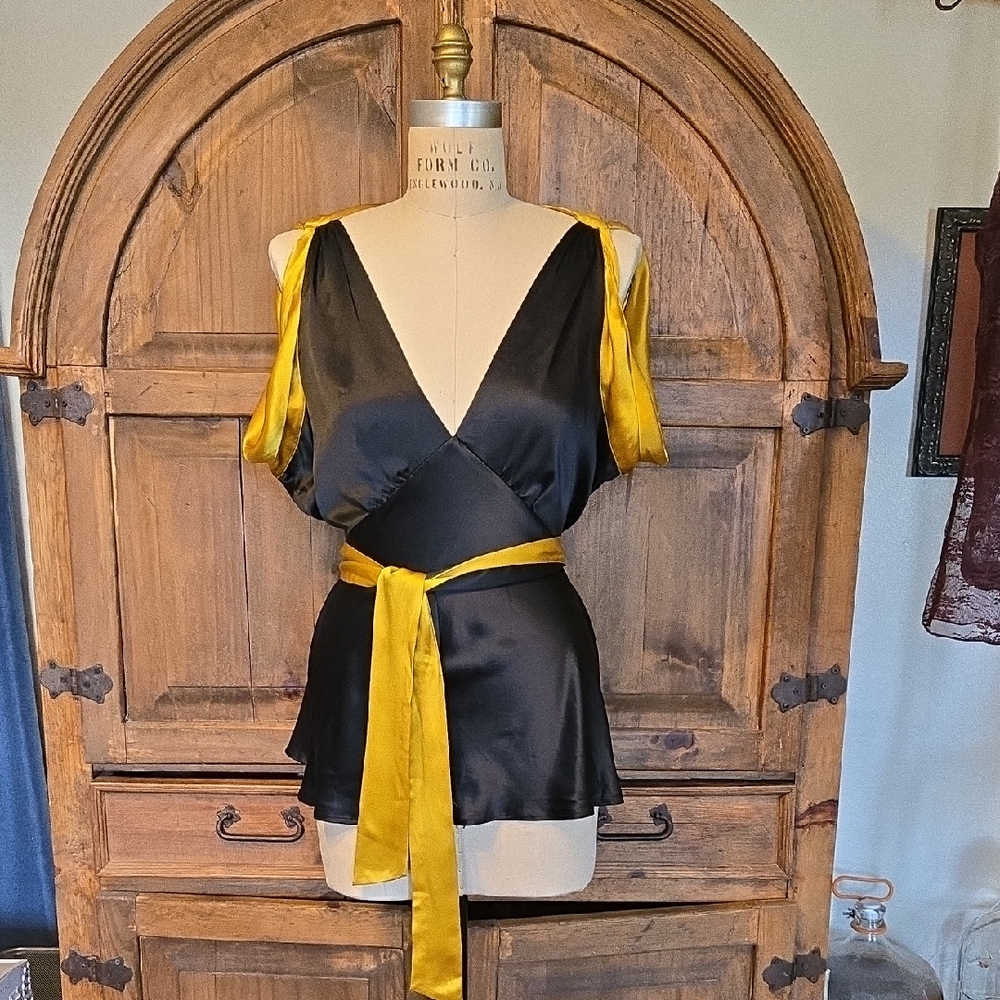 BCBGeneration Black and Gold Wrap Blouse